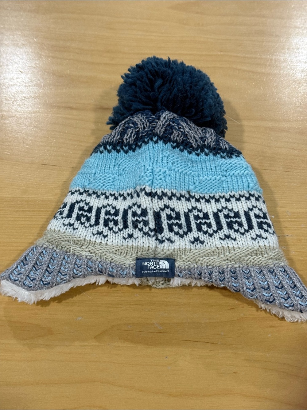 The North Face Baby Fair Isle Earflap Beanie New without tags.Sz. 0-6 months.